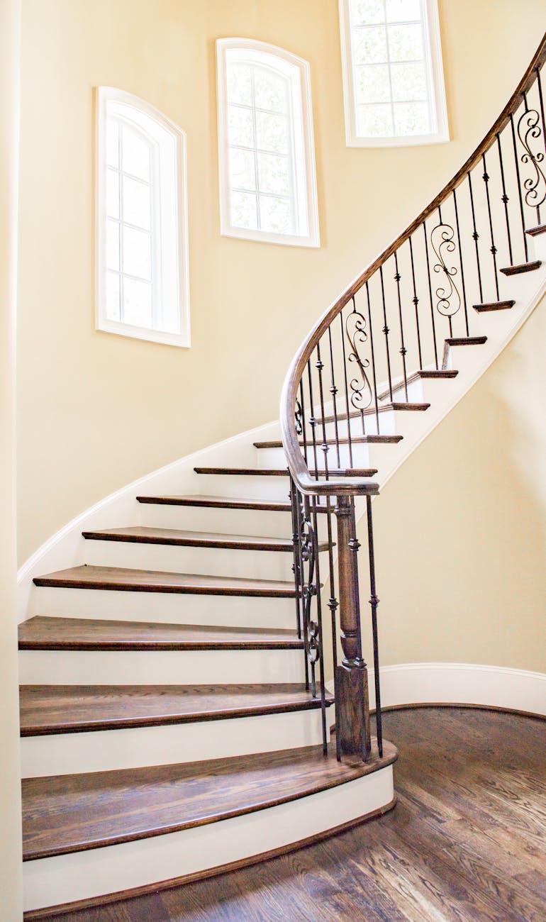 white and brown concrete helix stairs