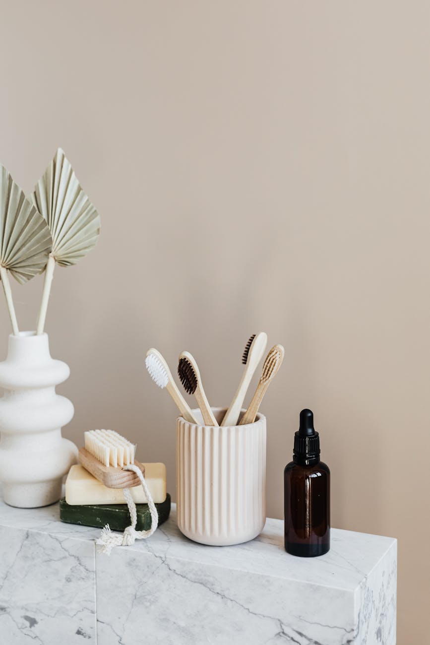 various zero waste natural toiletries on marble table in bathroom